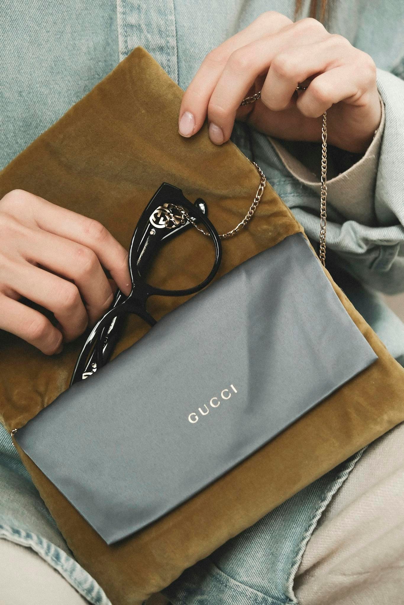 Gucci glasses in a stylish case, embodying luxury and fashion.